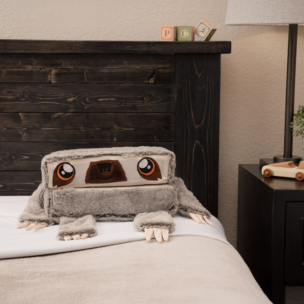 Pillow Cub Cube, sloth design on bed